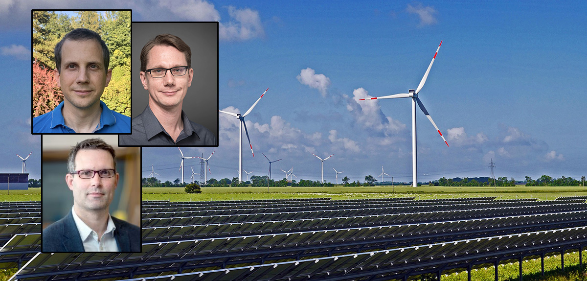 Image of the researchers on the left side with wind turbines in the background