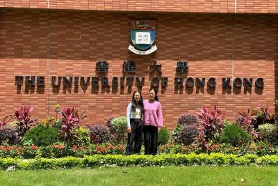 dssg fellows in front of the university of hong kong sign